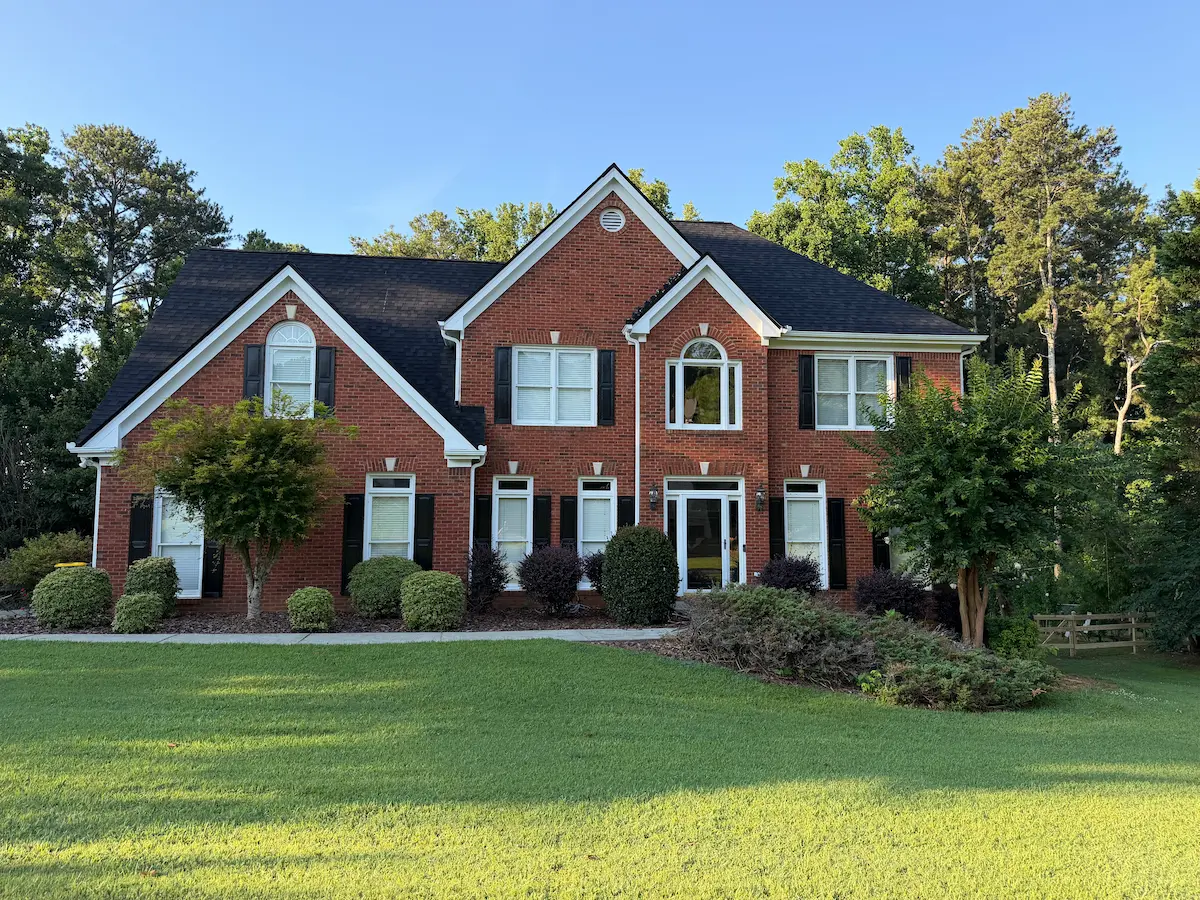 Before full front brick home window replacement